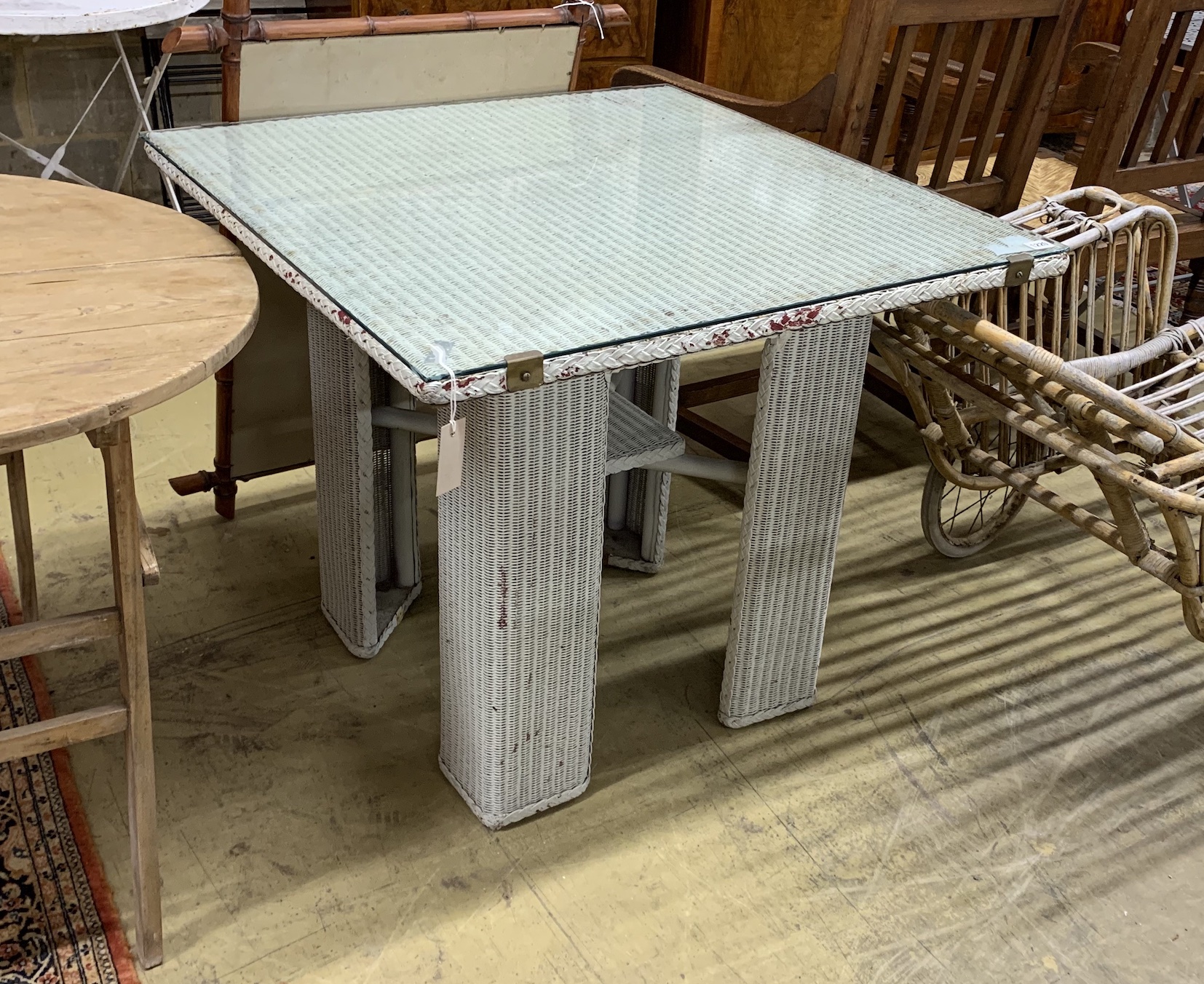 A vintage Lloyd Loom square table, width 84cm, height 72cm
